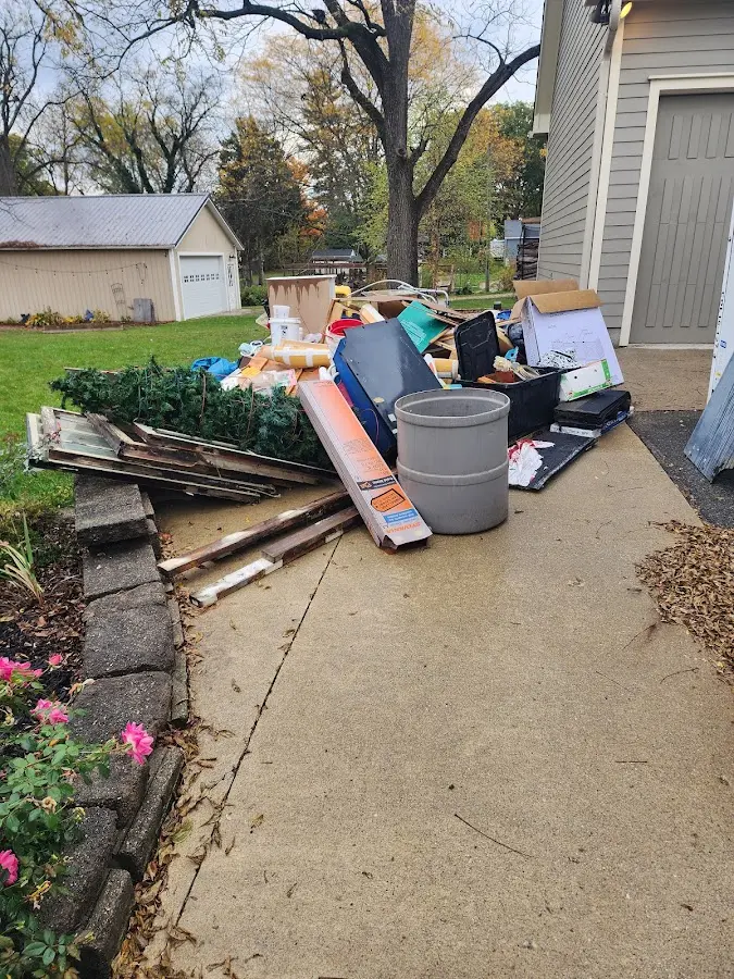 Dumpster being loaded with debris for Commercial Dumpster Rental in Hawthorne
